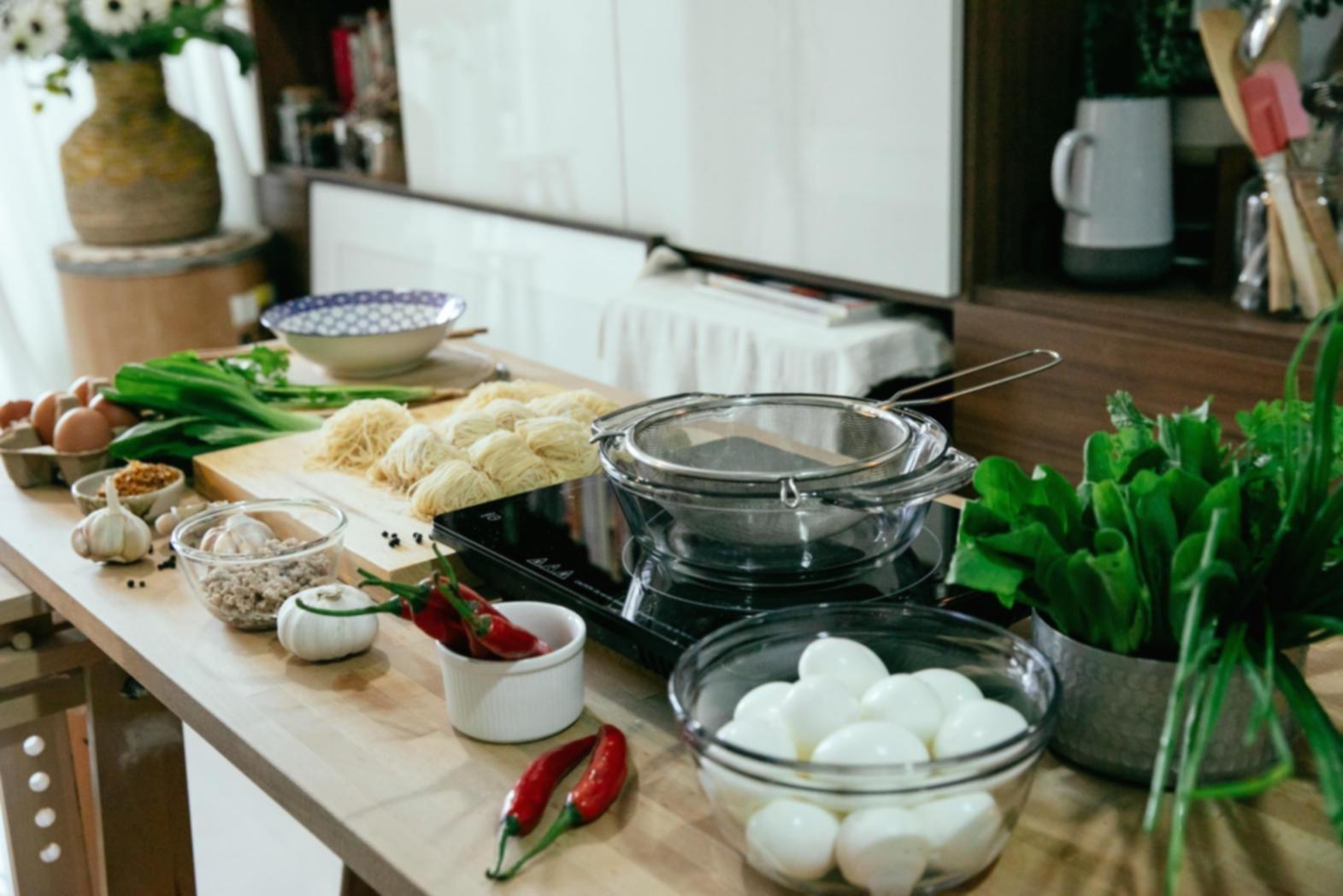 Professional baking workspace showing artisan pizza preparation